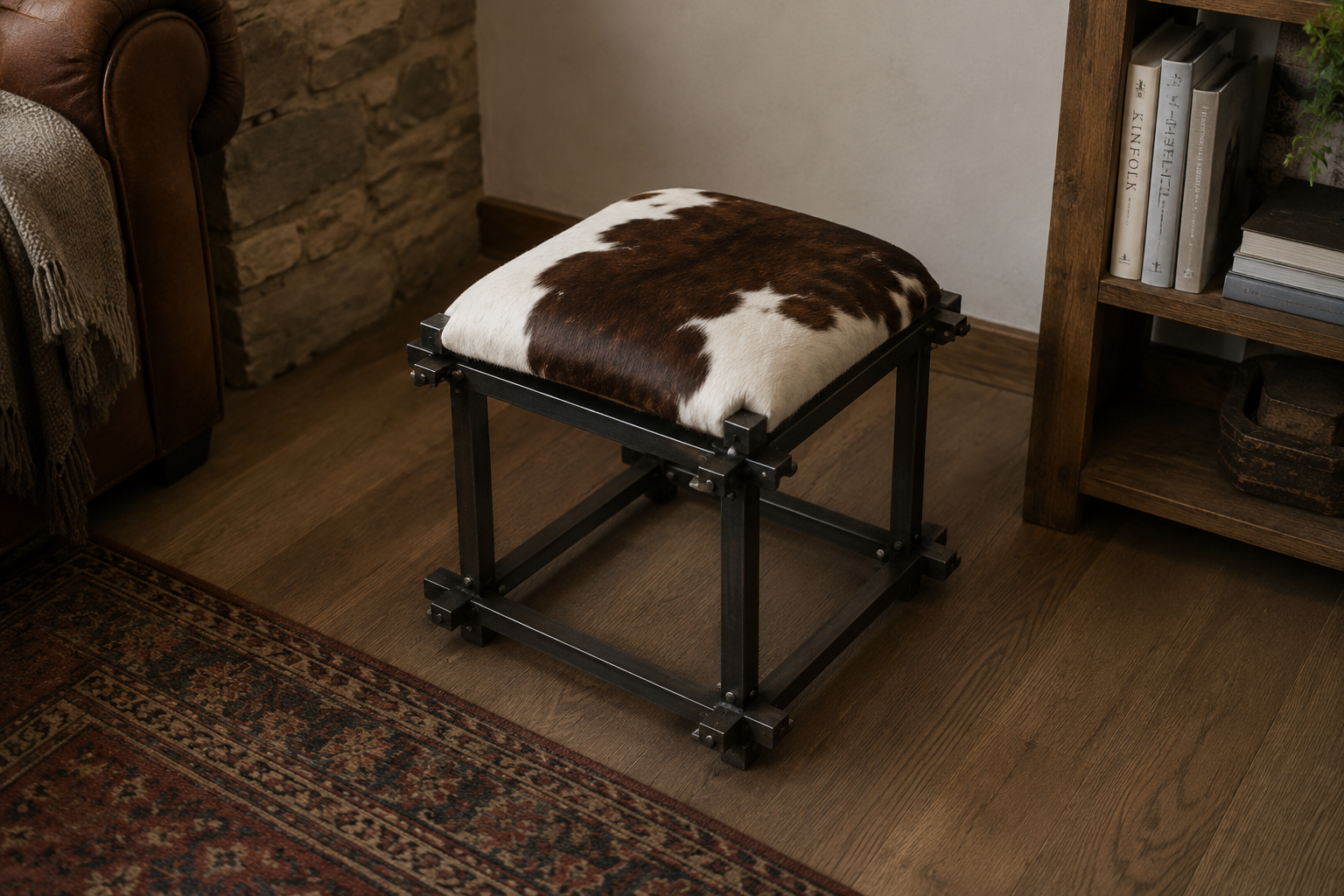 Cowhide Stool &mdash; blackened steel frame with cowhide cushion